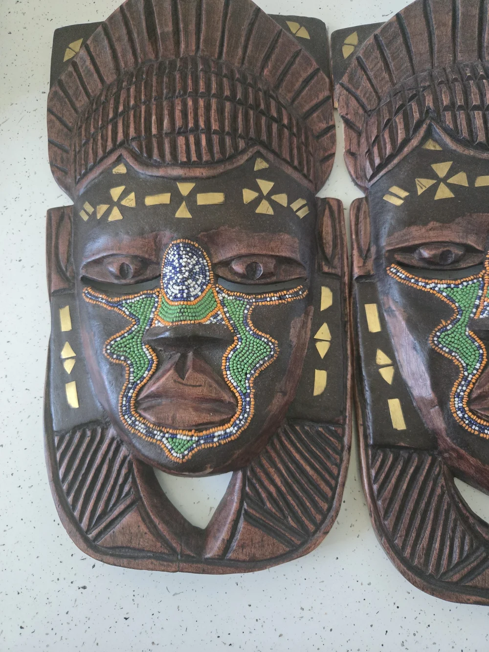 Hand-Carved Brown African Mask Wall Decor with Green Bead Accents